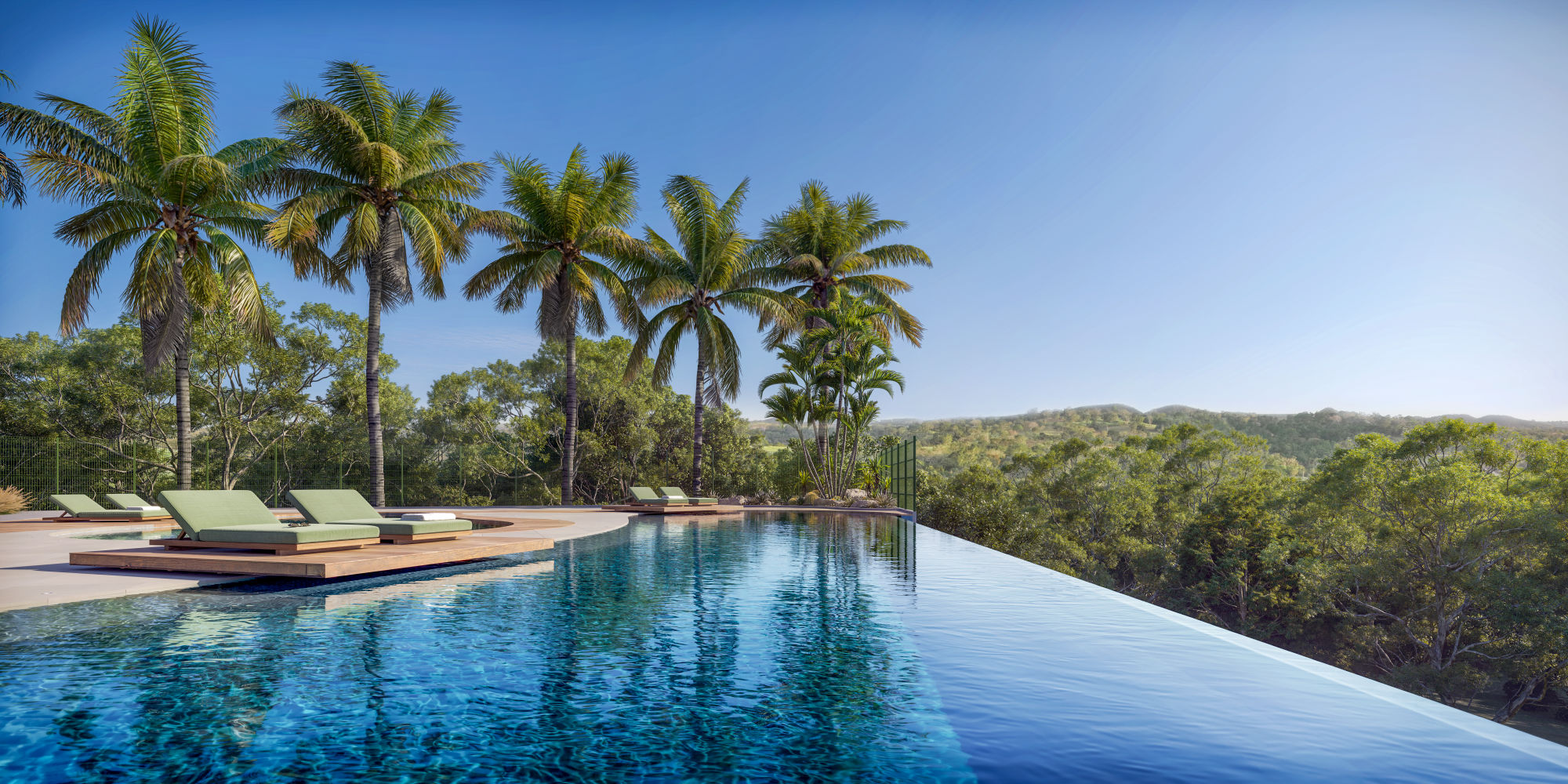 Pool deck com palmeiras e cabanas.
